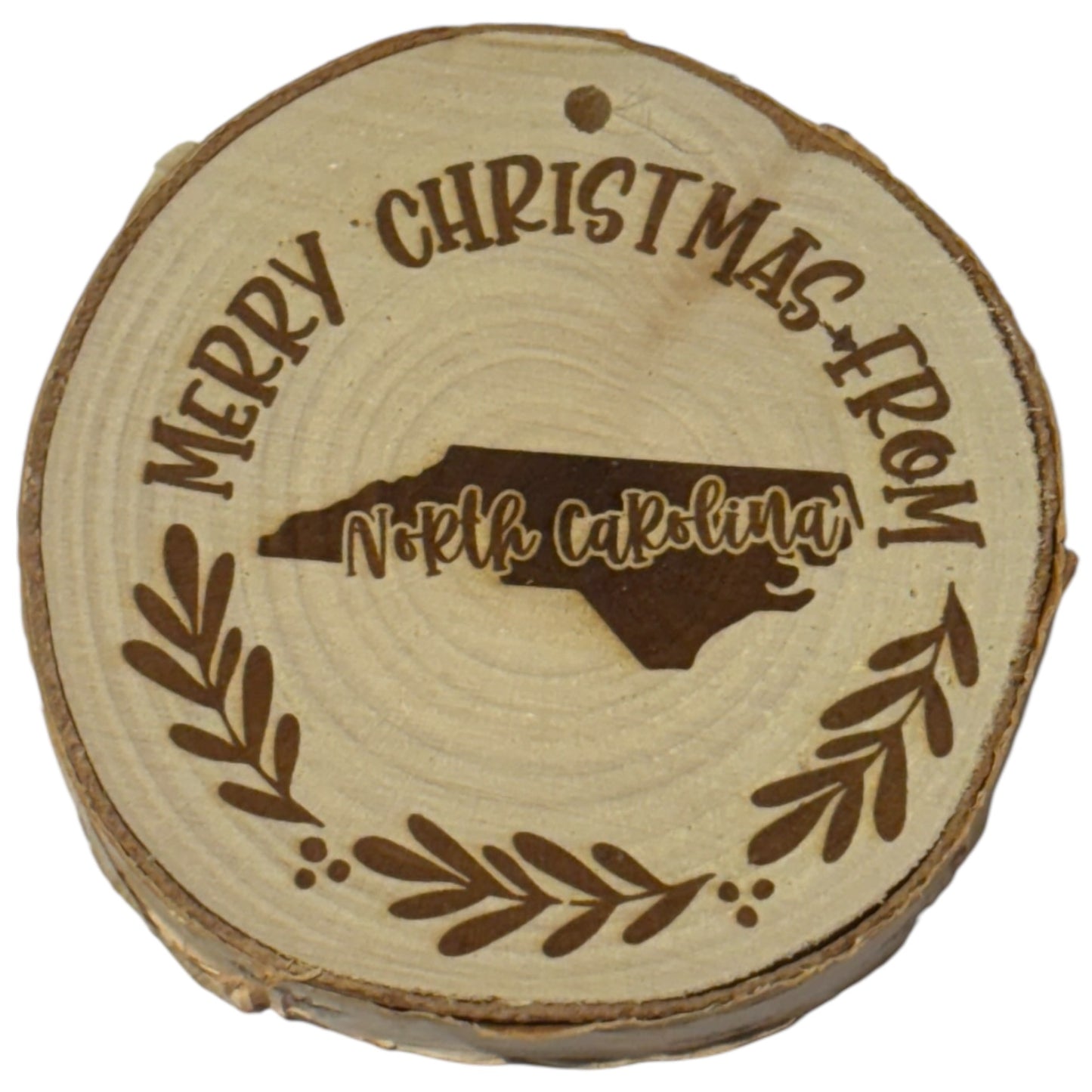 Merry Christmas from North Carolina Ornament – Engraved Rustic Wood Slice (3–4”)