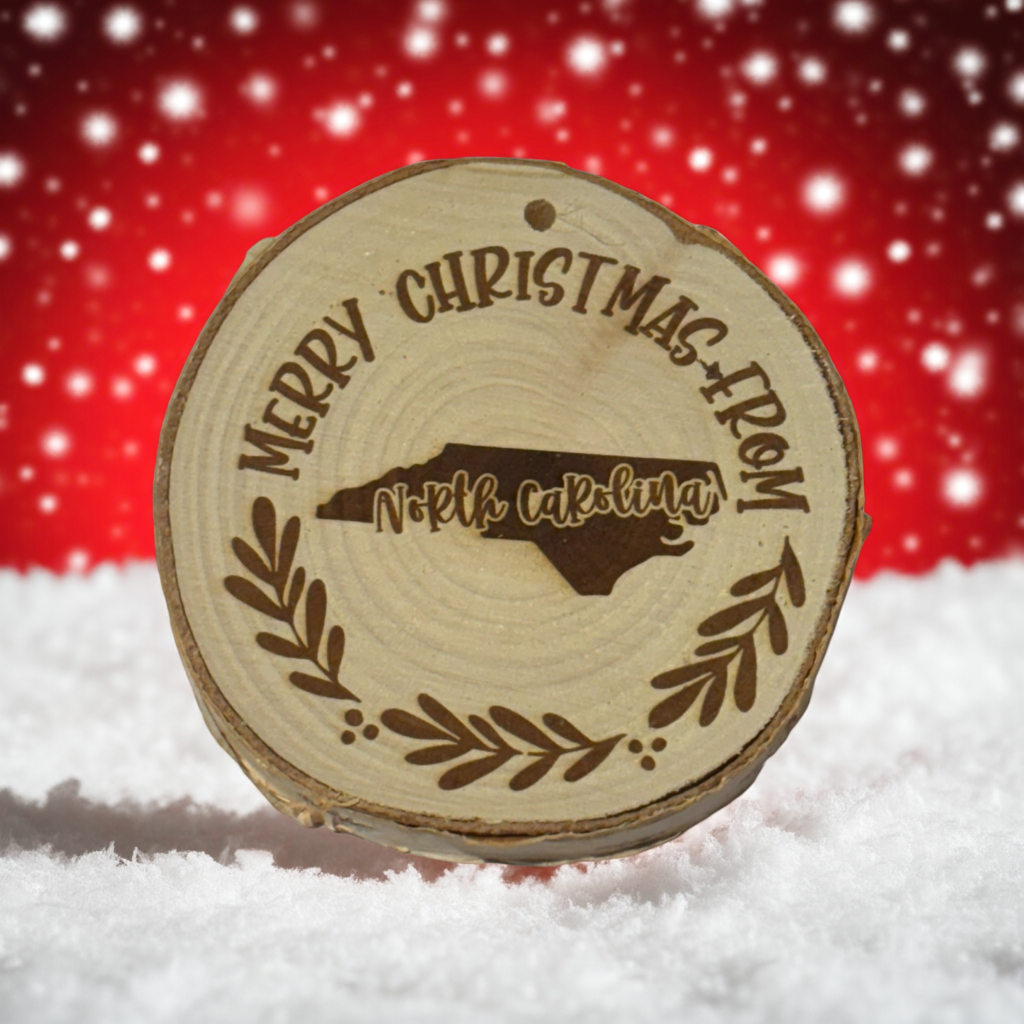 Merry Christmas from North Carolina Ornament – Engraved Rustic Wood Slice (3–4”)