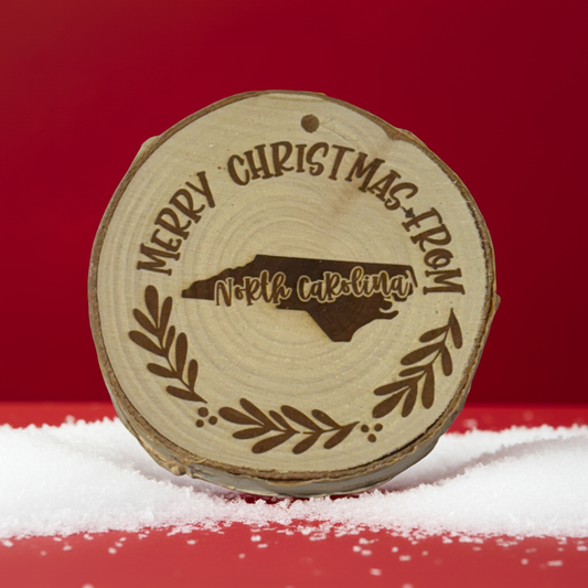 Merry Christmas from North Carolina Ornament – Engraved Rustic Wood Slice (3–4”)