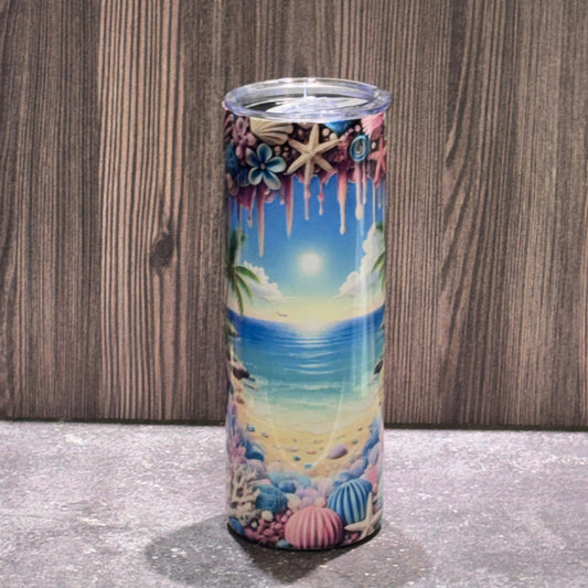Tumbler with a beach-themed design on a wooden surface