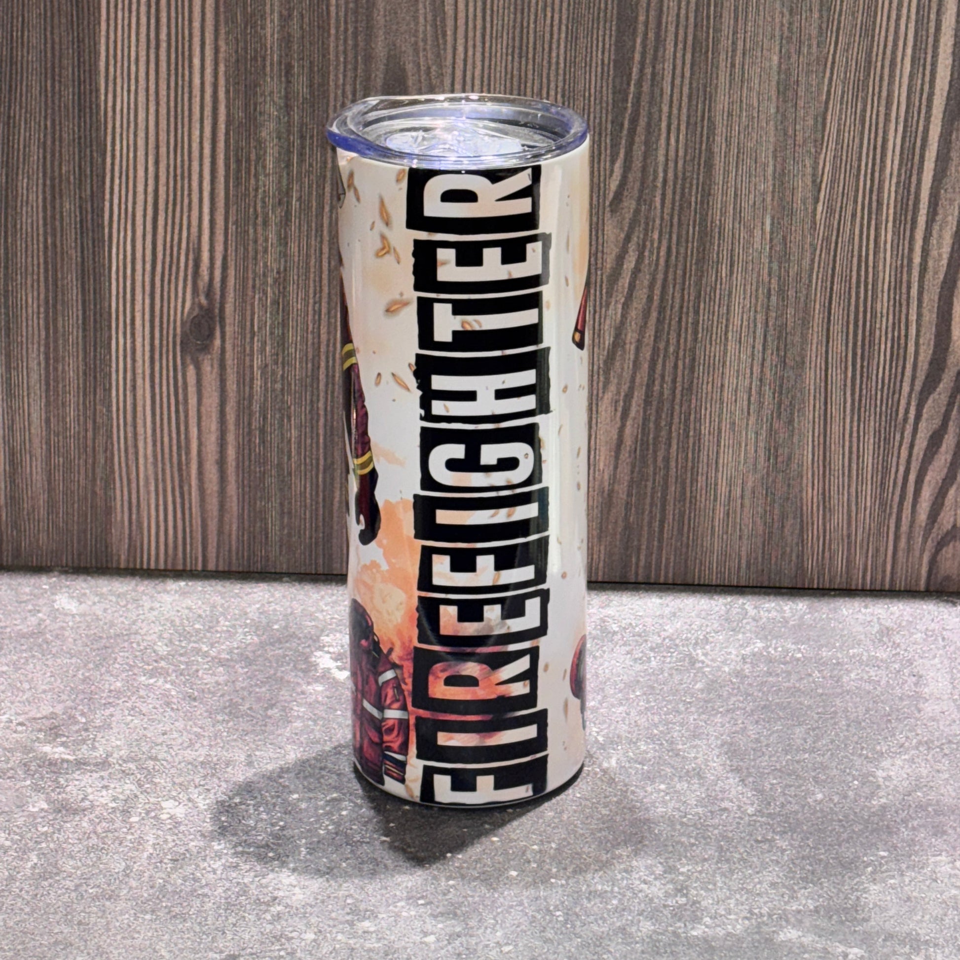 20 oz stainless steel skinny tumbler featuring firefighter-themed artwork and bold FIREFIGHTER lettering with lid and straw.