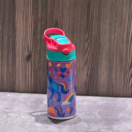 12 oz stainless steel kids tumbler featuring colorful unicorns, stars, moons, and gems with a flip-top straw lid.